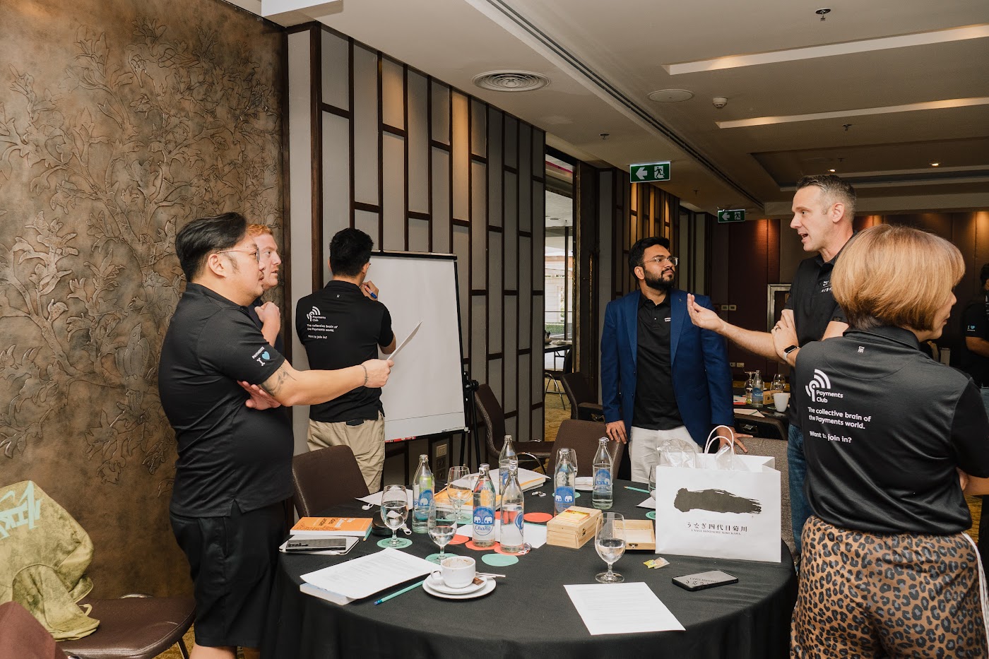 A group collaborating and sharing ideas around a retreat table