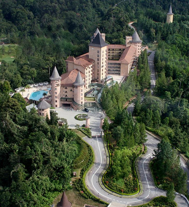 The castle at the top of a winding forest drive