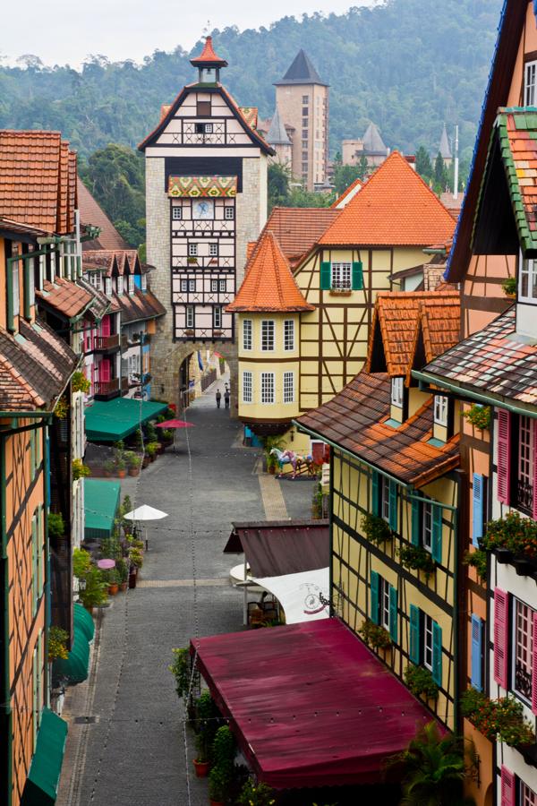 A cobbled lane of half-timbered French houses in Colmar Tropicale