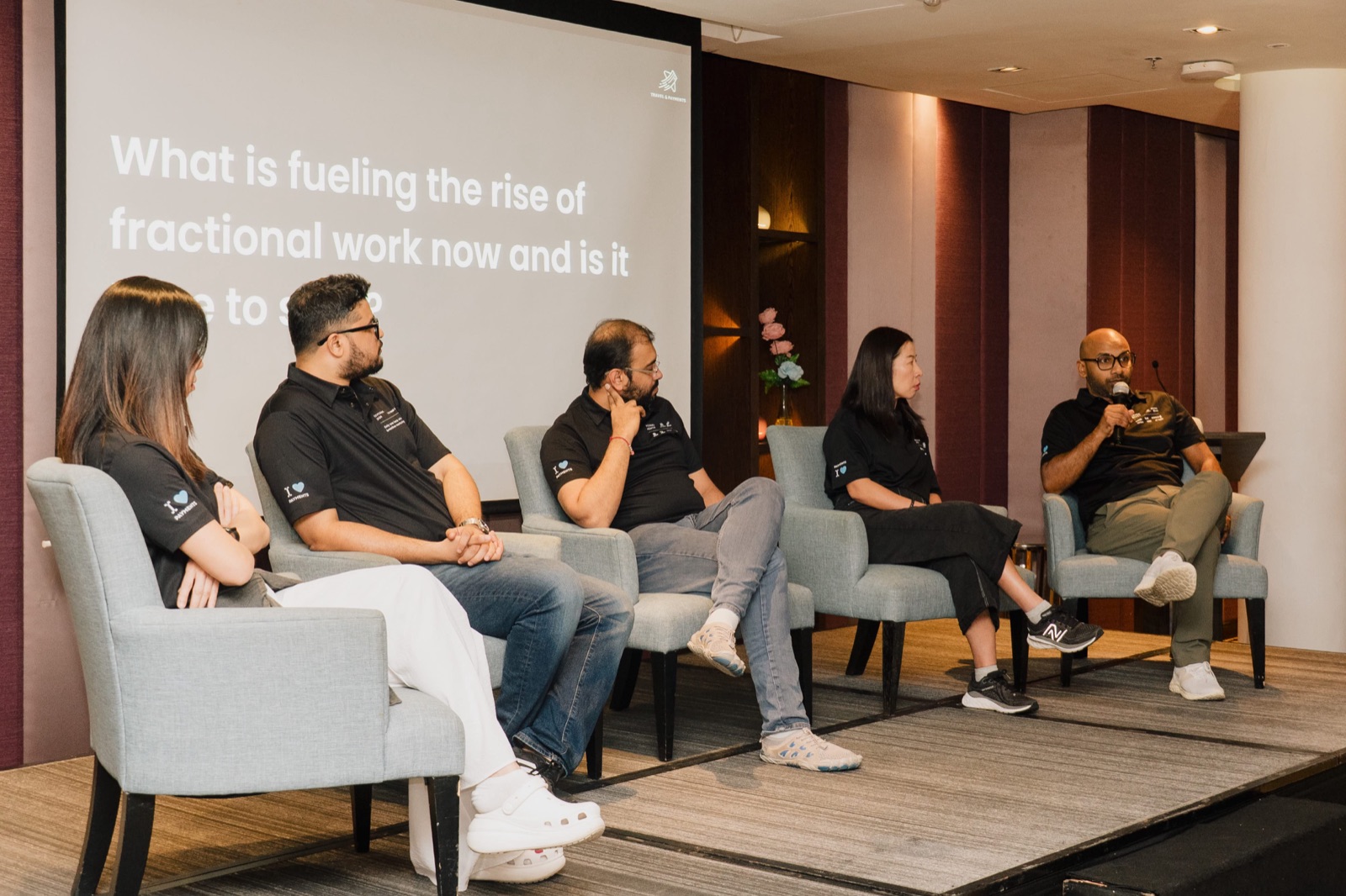 A panel of retreat speakers discussing the rise of fractional work