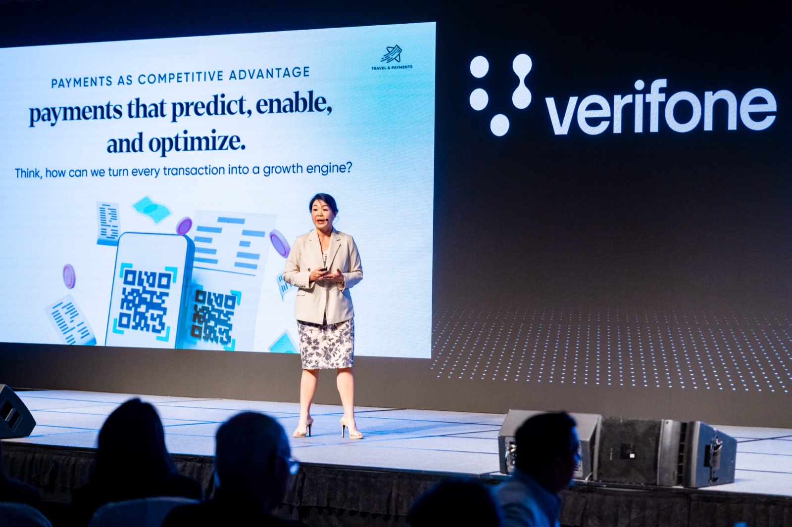 A Travel & Payments speaker presenting on payments as a competitive advantage on stage
