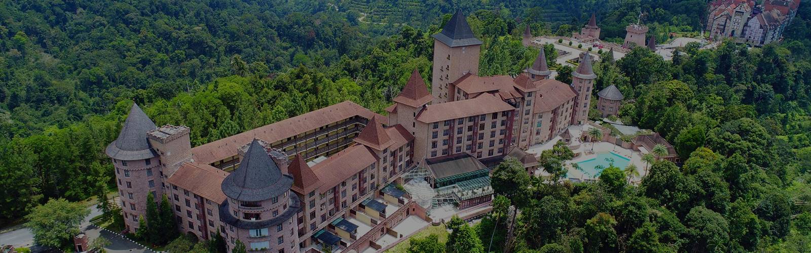 The Chateau's castle wings among the forest